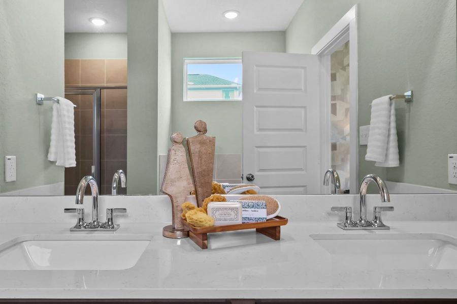 A bathroom with a large mirror. A bathroom with a large mirror.