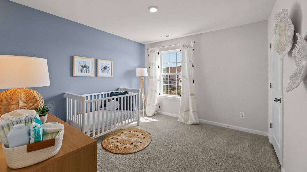 Furnished interior in a model home at Ridgewood Farms in Winterville (Image 29).