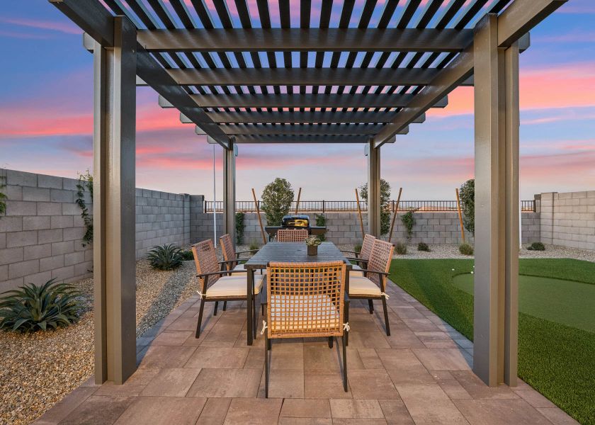 A patio with a table and chairs. A patio with a table and chairs.