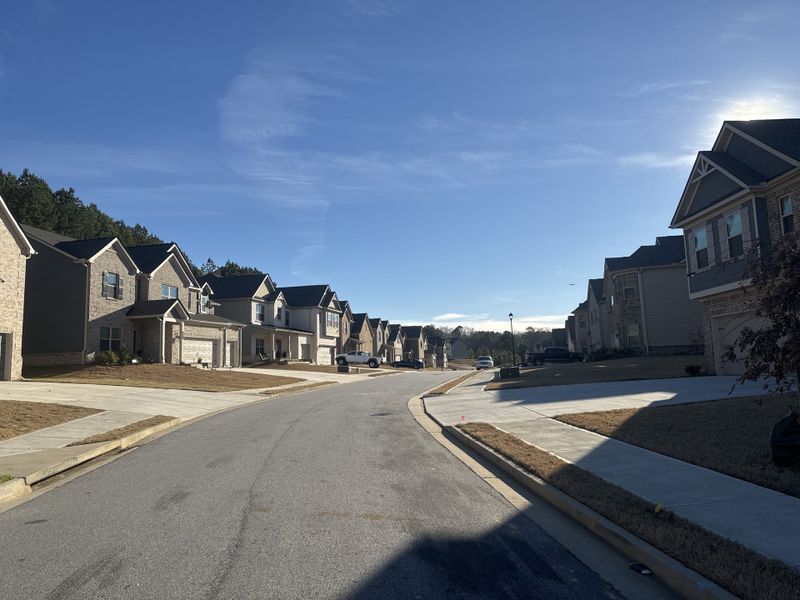 Front exterior of a home in the Camp Creek Village community, located in Atlanta, GA (Image 14). Front exterior of a home in the Camp Creek Village community, located in Atlanta, GA (Image 14).