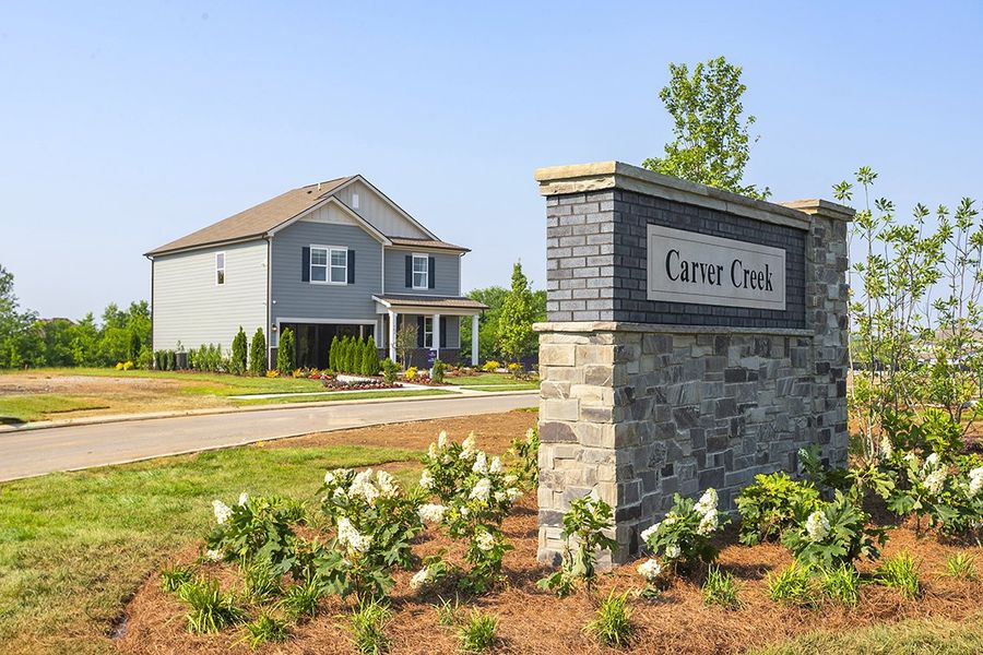 A house with a sign on the front. A house with a sign on the front.