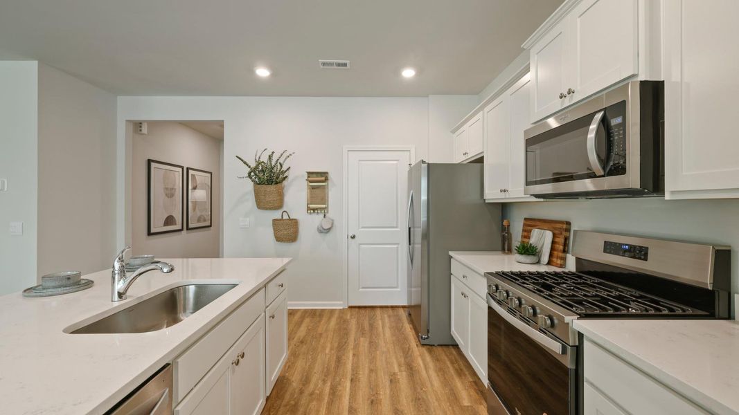 Furnished interior in a model home at Pineview North in Summerville (Image 5).