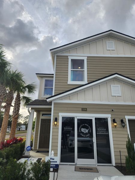 A charming beige home with white trim and a welcoming entry in Briarwood by D.R. Horton (Jacksonville, FL). A charming beige home with white trim and a welcoming entry in Briarwood by D.R. Horton (Jacksonville, FL).