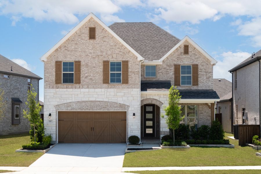 Front exterior of a home in the Valencia on the Lake community, located in Little Elm, TX (Image 3).