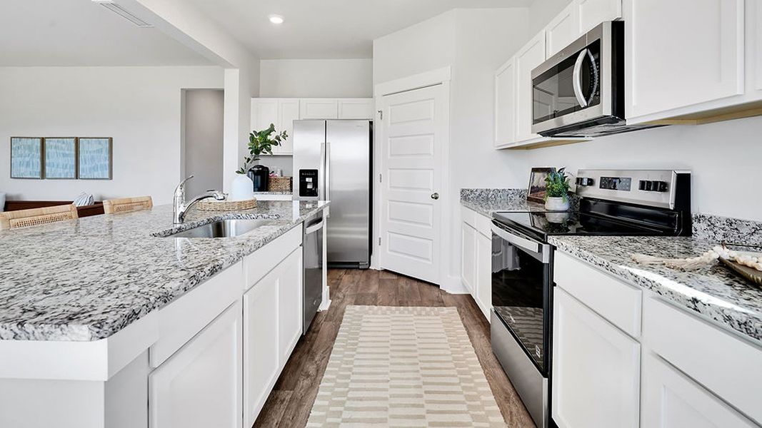 Furnished interior in a model home at Cedar Hill Landing in Navassa (Image 5).