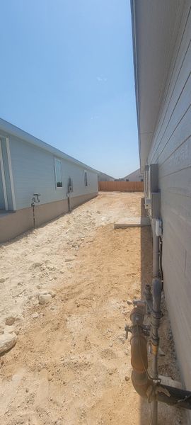 A side view of homes with sandy yards in Landon Ridge by Lennar, San Antonio, TX. A side view of homes with sandy yards in Landon Ridge by Lennar, San Antonio, TX.