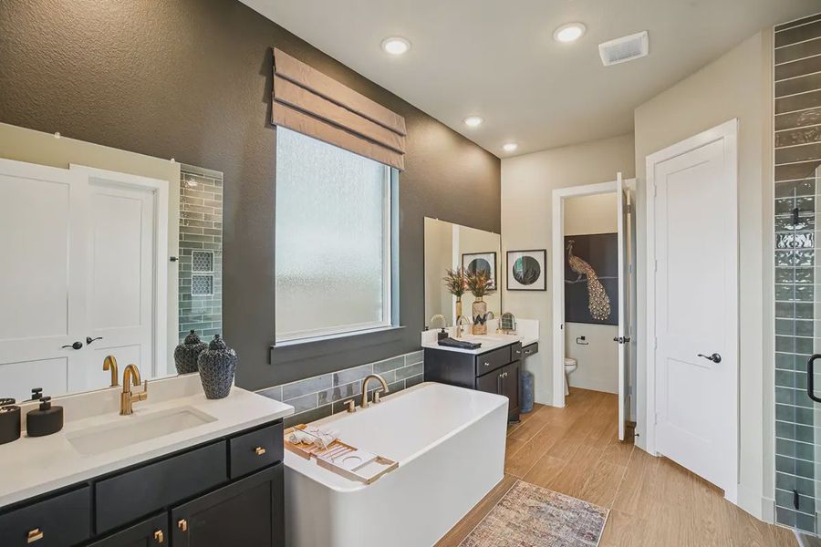 Furnished interior in a model home at Meridiana 50's in Manvel (Image 31).