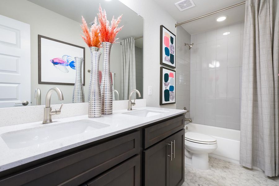 Furnished interior in a model home at Cloverleaf in Austin (Image 55).