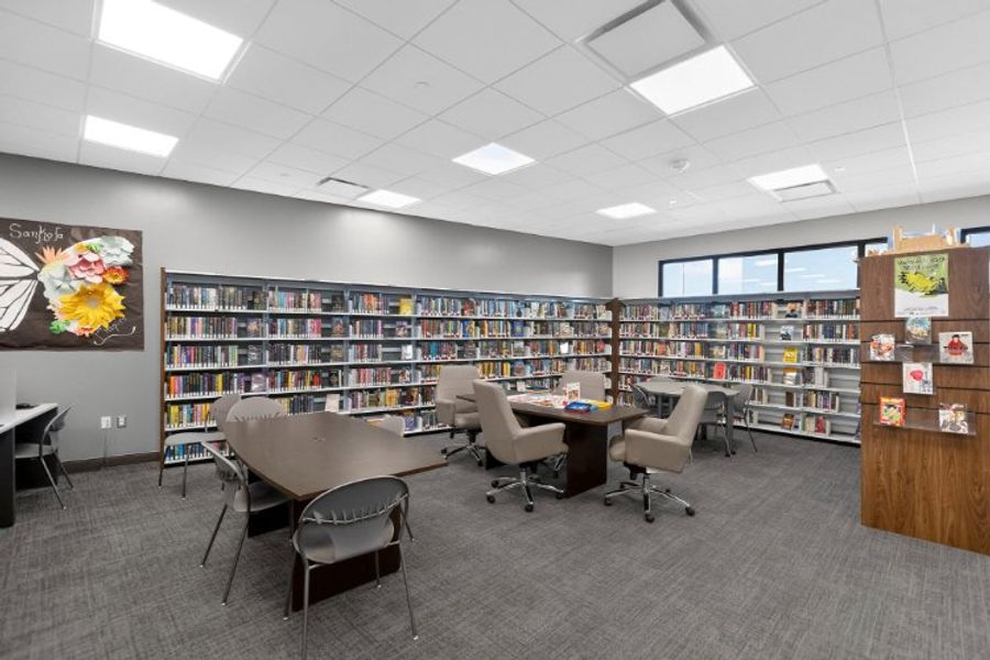 A room with a table and chairs. A room with a table and chairs.