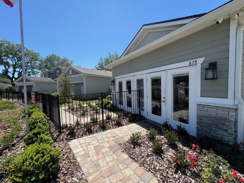 Charming home with a stone accent exterior and landscaped path in Seasons at Marietta Cove by Richmond American Homes (Jacksonville, FL).