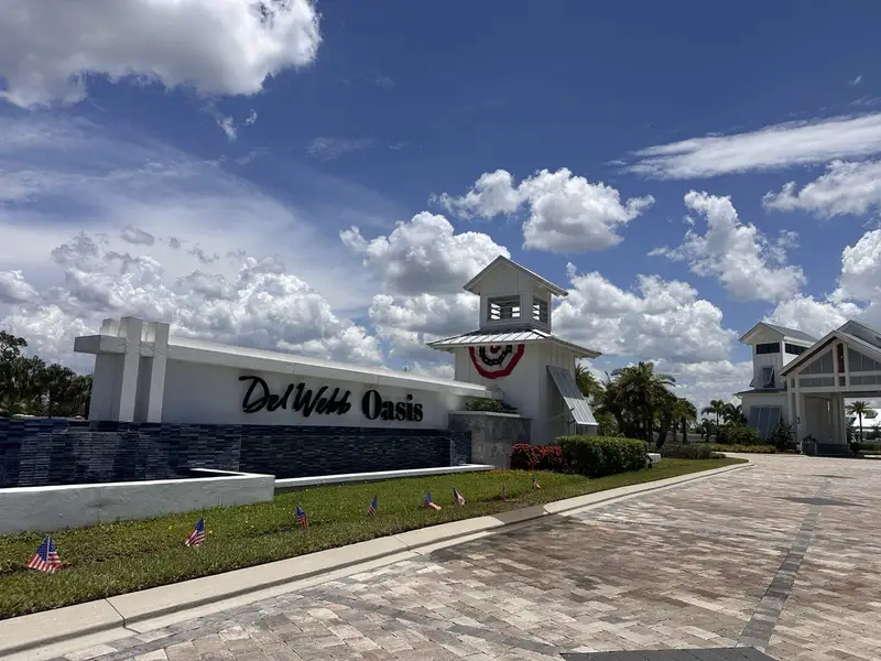 A welcoming entrance with crisp white exteriors in Del Webb Oasis by Del Webb, Winter Garden, FL.