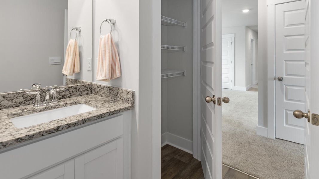 Furnished interior in a model home at Eagle Creek in Bolivia (Image 37).