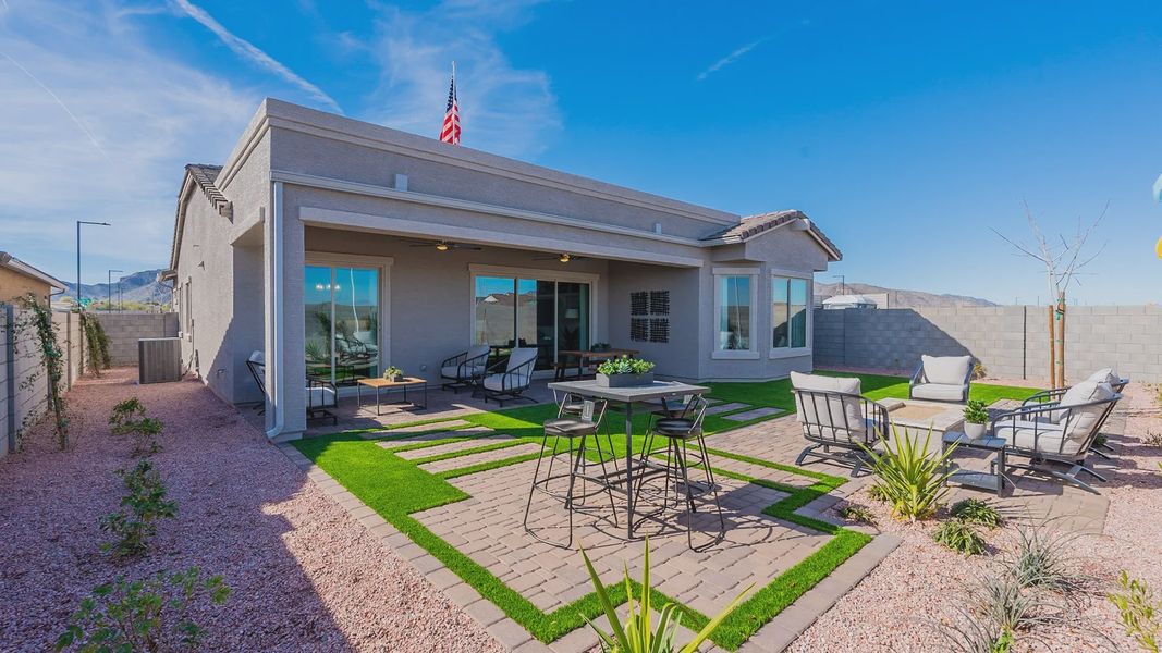 Luxurious outdoor living features chic seating, artificial turf, and elegant pavers in Arroyo Seco. Luxurious outdoor living features chic seating, artificial turf, and elegant pavers in Arroyo Seco.
