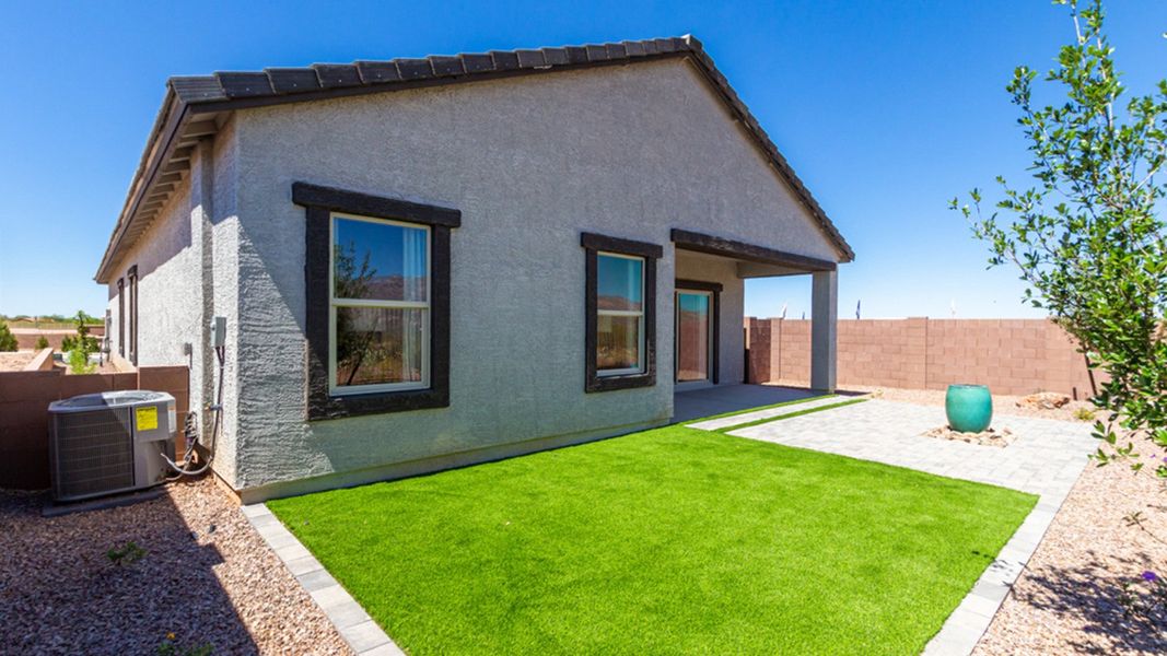Front exterior of a home in the The Oasis at Rocking K community, located in Vail, AZ (Image 10).