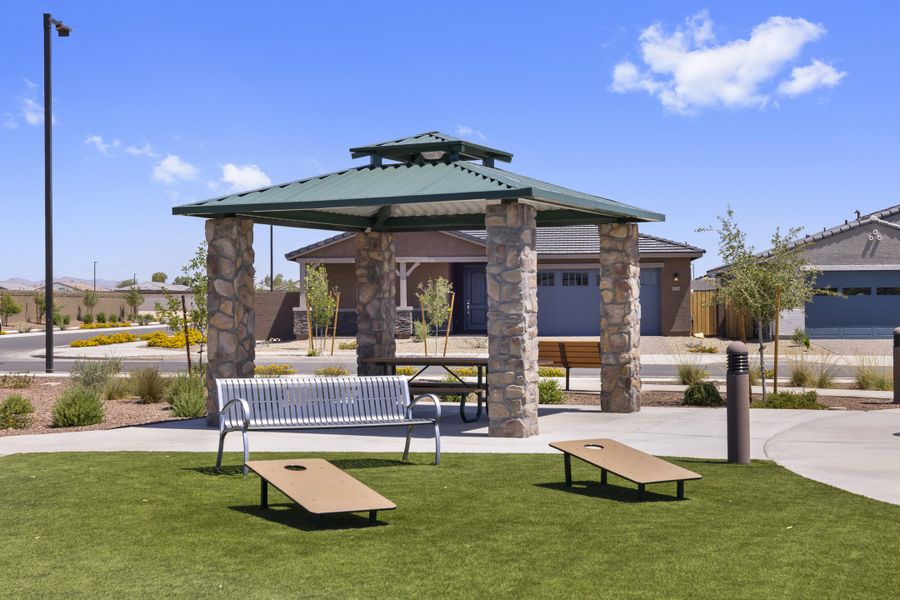 Cornhole entertainment and park benches at El Cidro.