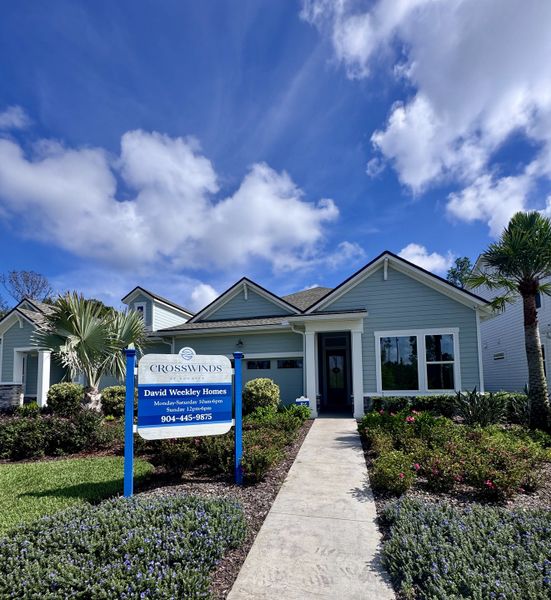 A charming blue home with a lush landscaped yard in Crosswinds 40' Paired Villas by David Weekley Homes (Ponte Vedra, FL). A charming blue home with a lush landscaped yard in Crosswinds 40' Paired Villas by David Weekley Homes (Ponte Vedra, FL).