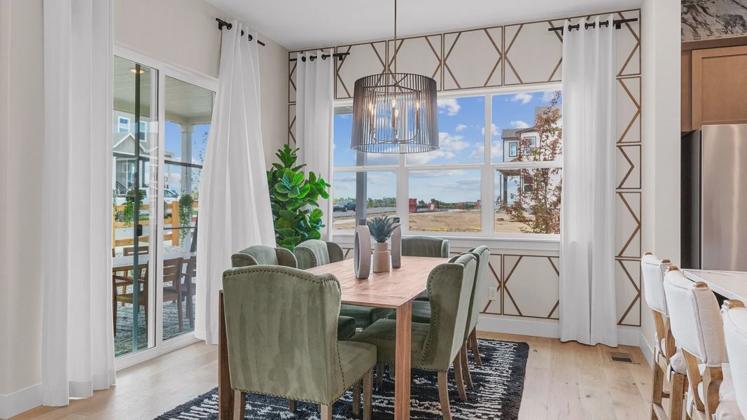 Experience luxury dining with chic geometric accents and lush green seating, nestled in Dillon Pointe's serene ambiance. Experience luxury dining with chic geometric accents and lush green seating, nestled in Dillon Pointe's serene ambiance.