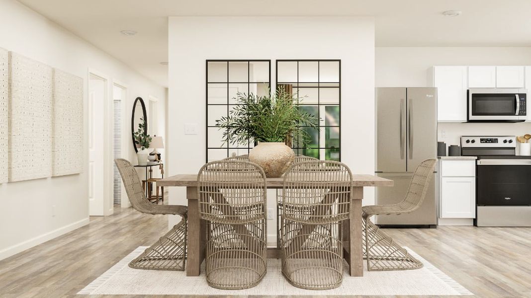 A dining room with a table and chairs. A dining room with a table and chairs.