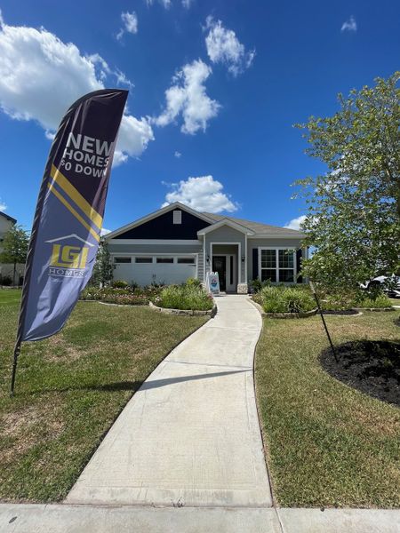 A charming single-story home with lush landscaping in Park Vista at El Tesoro by LGI Homes (Houston, TX).