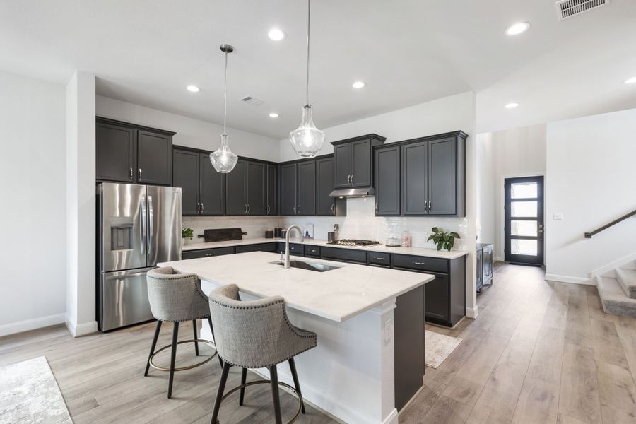 Furnished interior in a model home at Sunterra in Katy (Image 29).