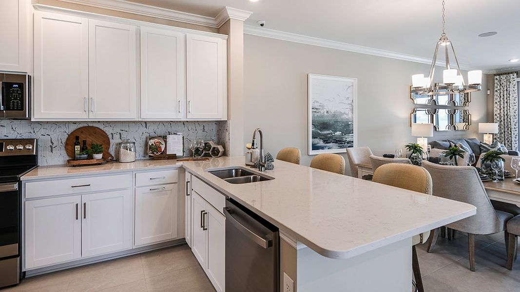 Furnished interior in a model home at Esplanade Lake Club Condos in Fort Myers (Image 41).