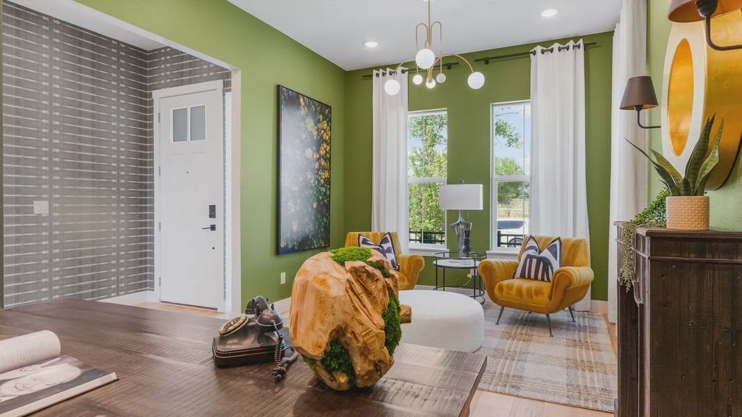 Delight in chic mustard seating, modern lighting, and expansive windows in this Dillon Pointe haven. Delight in chic mustard seating, modern lighting, and expansive windows in this Dillon Pointe haven.
