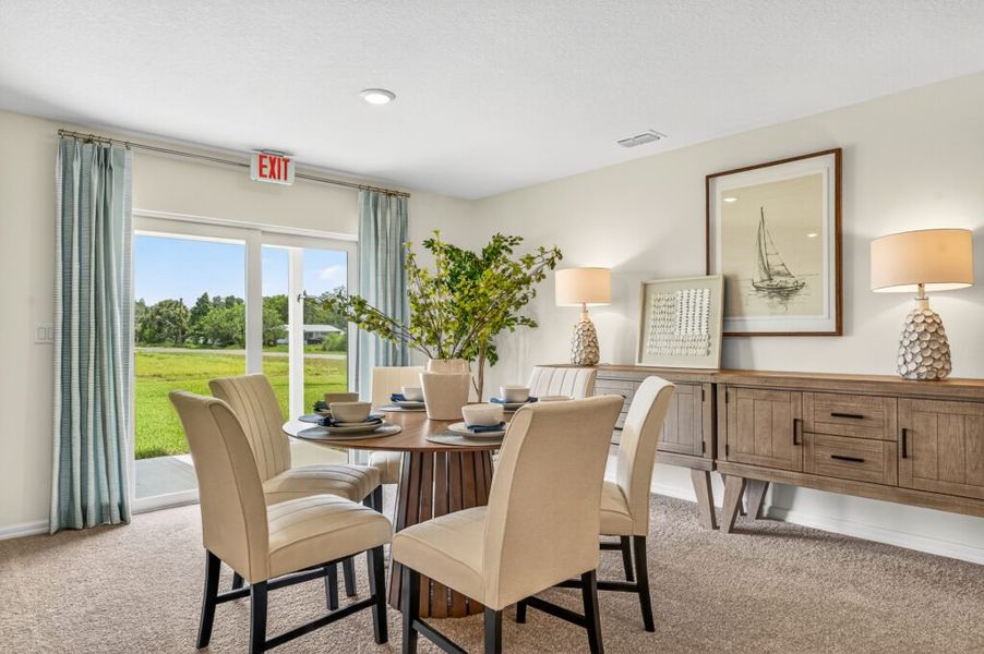 Furnished interior in a model home at Mallard Landing in Okeechobee (Image 6).