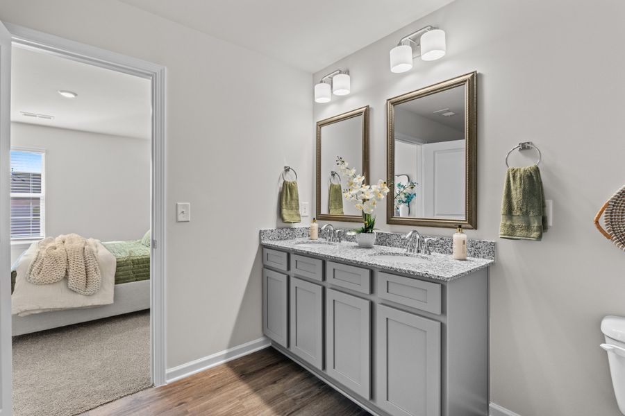 Furnished interior in a model home at Canary Woods in Hopkins (Image 17).