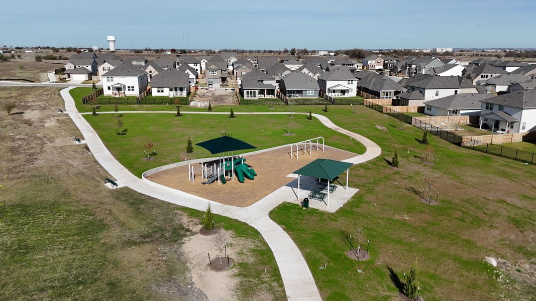 A scenic community park with playground and pathways in Patterson Ranch by Ashton Woods (Georgetown, TX). A scenic community park with playground and pathways in Patterson Ranch by Ashton Woods (Georgetown, TX).