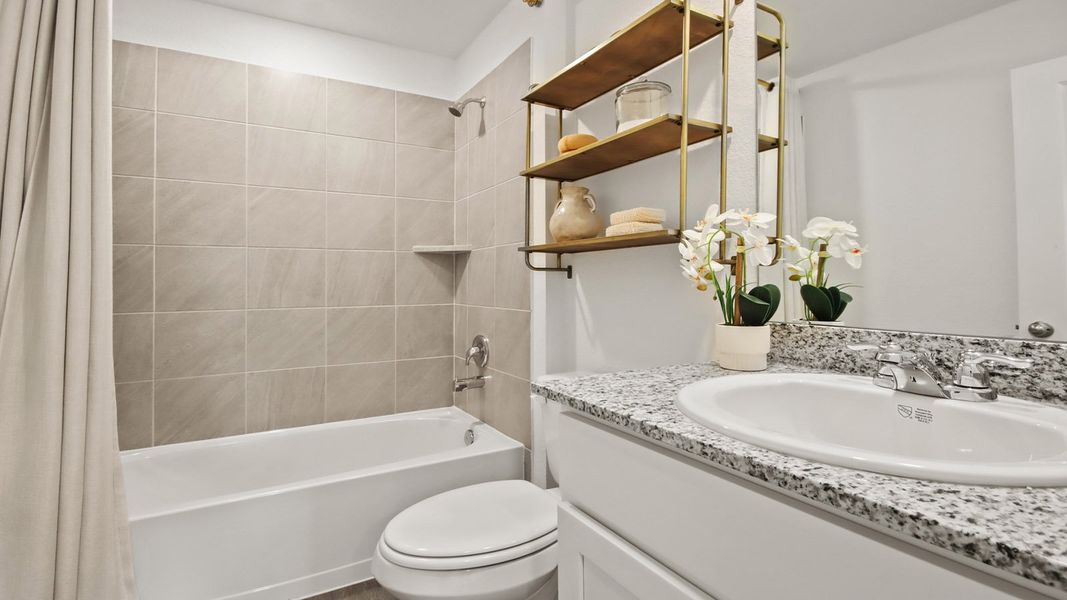 Furnished interior in a model home at Castles Edge in Willis (Image 11).