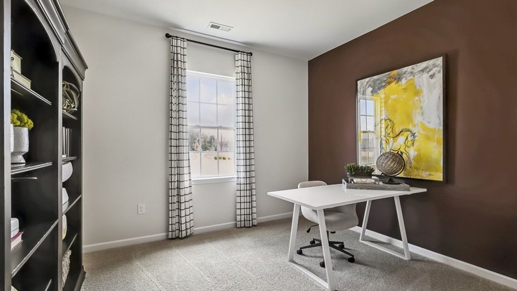 Furnished interior in a model home at The Reserve at Prestleigh in Wake Forest (Image 57).