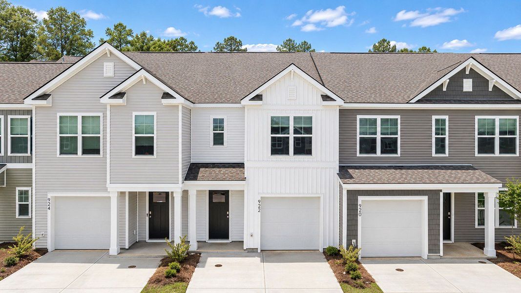 Front exterior of a home in the Pine Hills Townhomes at Cane Bay community, located in Summerville, SC (Image 2). Front exterior of a home in the Pine Hills Townhomes at Cane Bay community, located in Summerville, SC (Image 2).