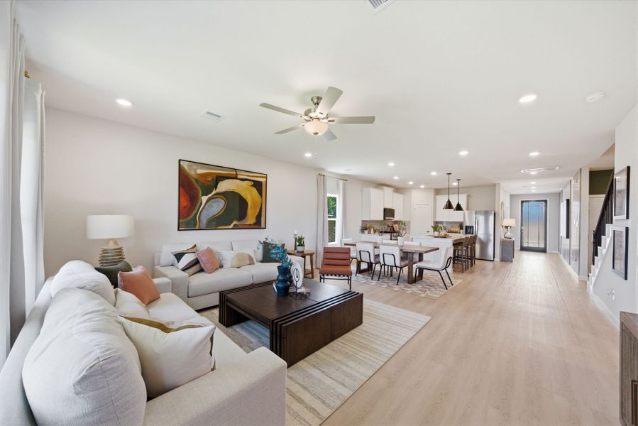 A living room with a wood floor. A living room with a wood floor.