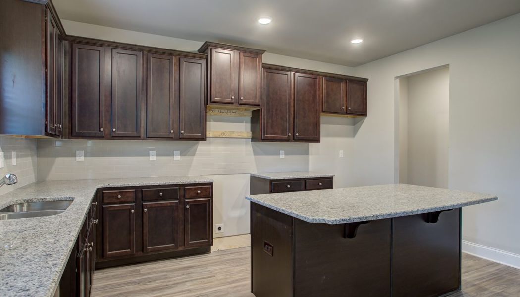 Furnished interior in a model home at North Village in Rydal (Image 20).