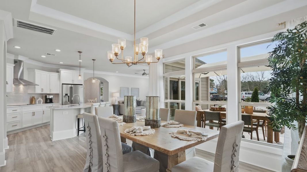 Furnished interior in a model home at Courtyards by Carrell in Ocean Isle Beach (Image 6).