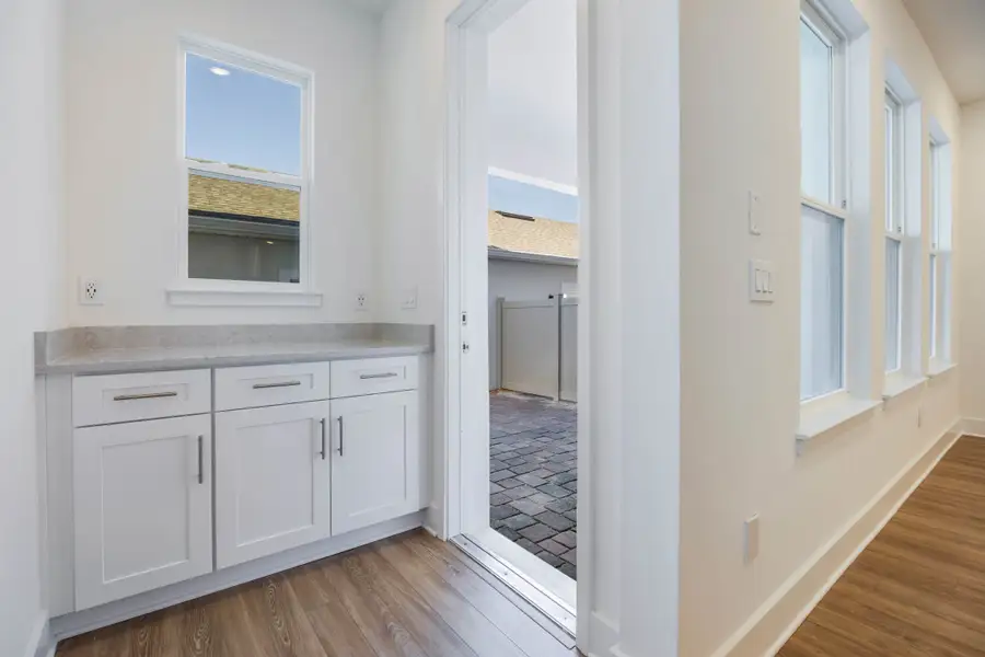 Furnished interior in a model home at Harvest at Ovation - Townhomes in Winter Garden (Image 68).