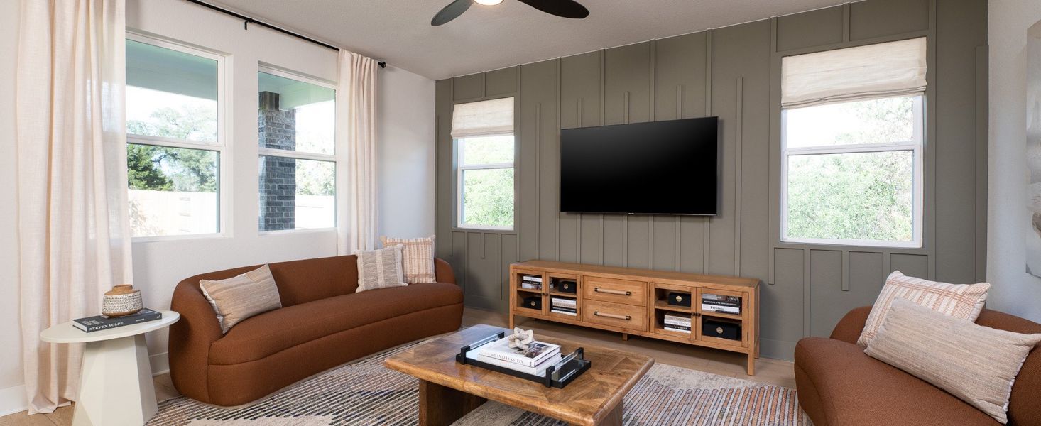 Furnished interior in a model home at Berry Creek Highlands in Georgetown (Image 5).