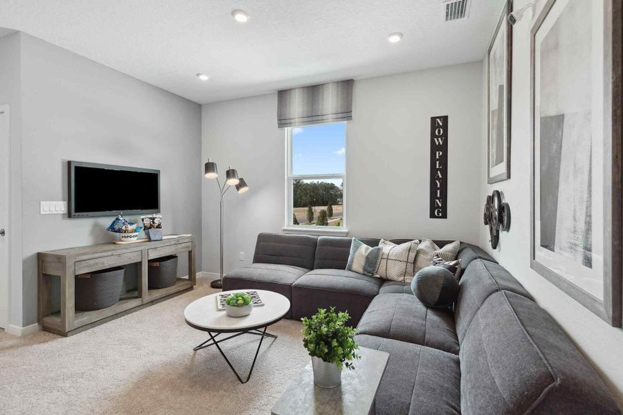 A living room with a couch and a coffee table. A living room with a couch and a coffee table.