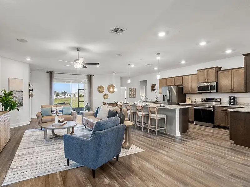These beautiful homes feature bright, open-concept layouts - Waylyn model home in St. Cloud, FL