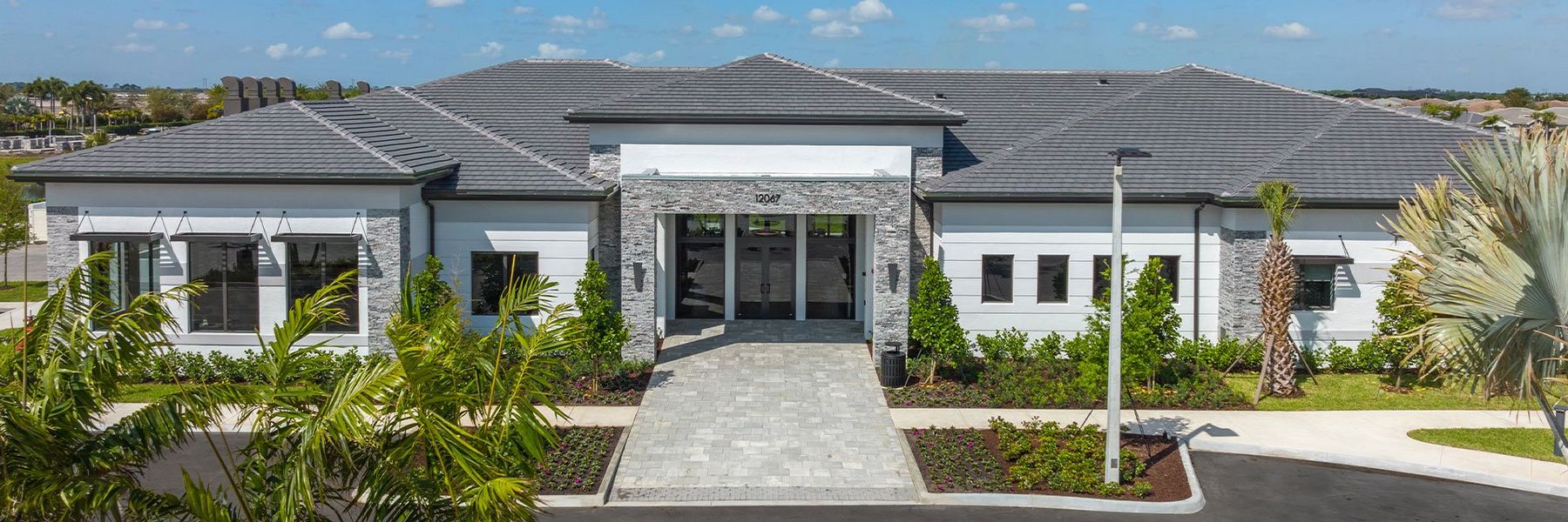 Front exterior of a home in the Valencia Parc at Riverland community, located in Port St. Lucie, FL (Image 4).