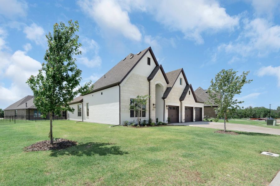 Front exterior of a home in the Heath Golf and Yacht Club community, located in Heath, TX (Image 9). Front exterior of a home in the Heath Golf and Yacht Club community, located in Heath, TX (Image 9).