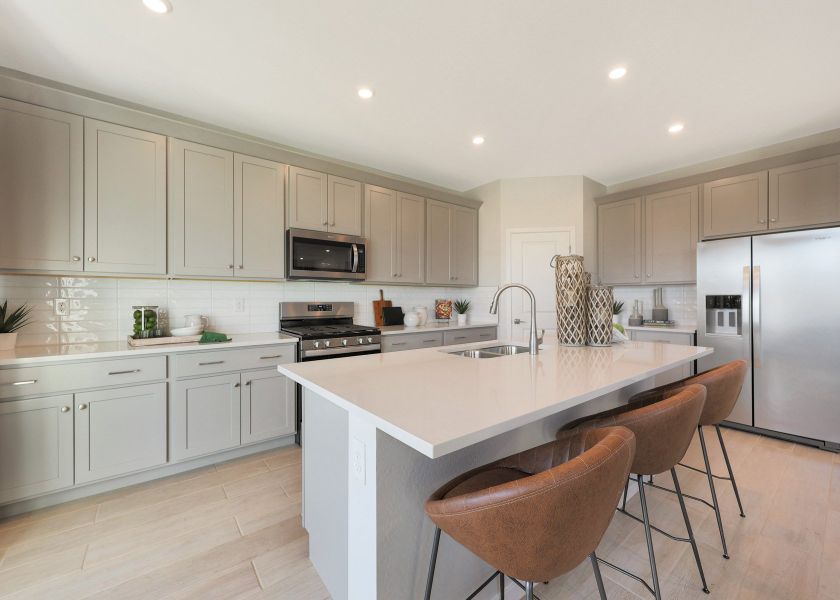 A kitchen with white cabinets. A kitchen with white cabinets.