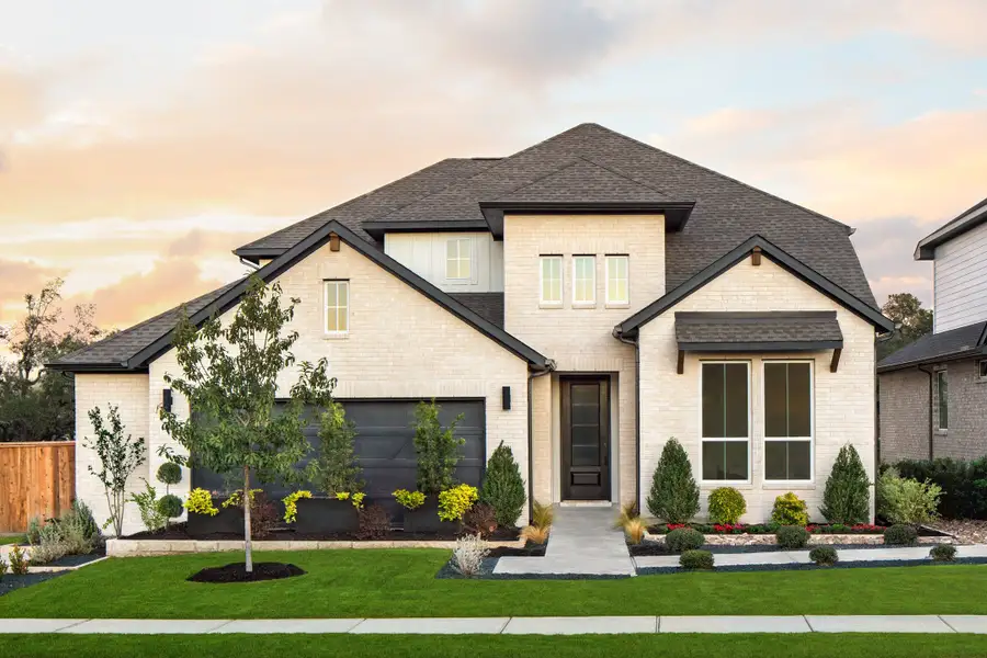 Front exterior of a home in the Parkside on the River community, located in Georgetown, TX (Image 3).