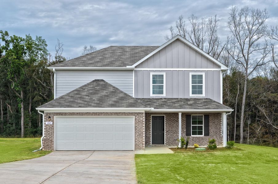 A house with a garage with American Gothic House in the background.