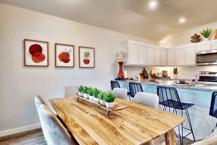 A kitchen with a dining table. A kitchen with a dining table.