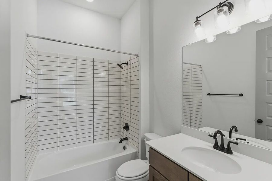 Furnished interior in a model home at Grand Lakes Estates in Montgomery (Image 16).