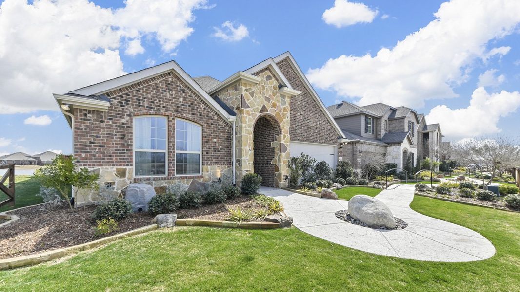 Front exterior of a home in the Silverado community, located in Aubrey, TX (Image 28). Front exterior of a home in the Silverado community, located in Aubrey, TX (Image 28).