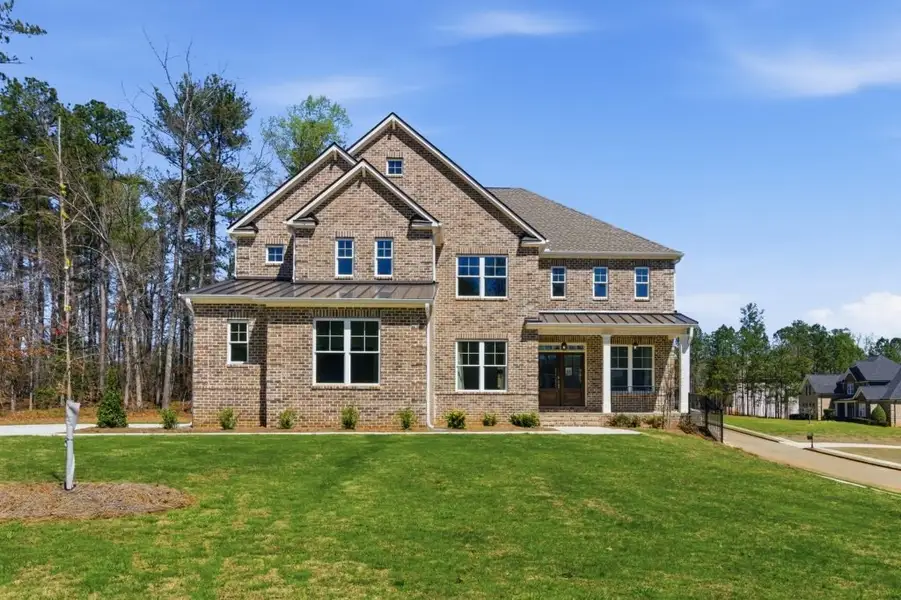 Front exterior of a home in the The Estates at Hurricane Pointe community, located in Douglasville, GA (Image 1). Front exterior of a home in the The Estates at Hurricane Pointe community, located in Douglasville, GA (Image 1).