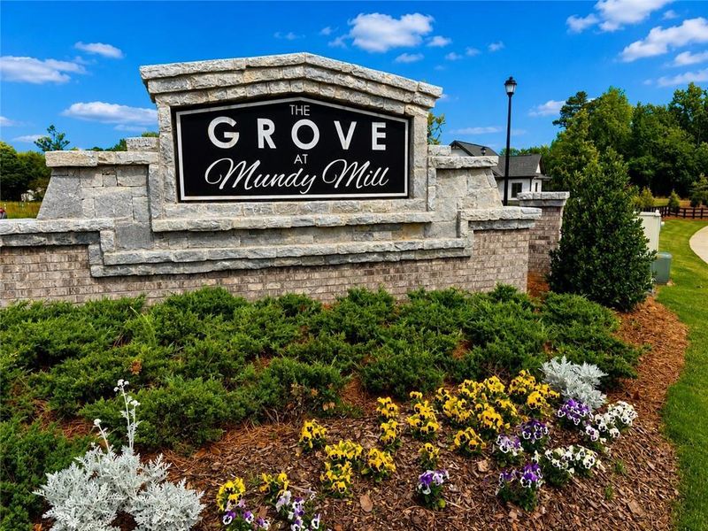 Entrance to the The Grove at Mundy Mill community in Gainesville, GA, featuring signage and landscaping (Image 2). Entrance to the The Grove at Mundy Mill community in Gainesville, GA, featuring signage and landscaping (Image 2).