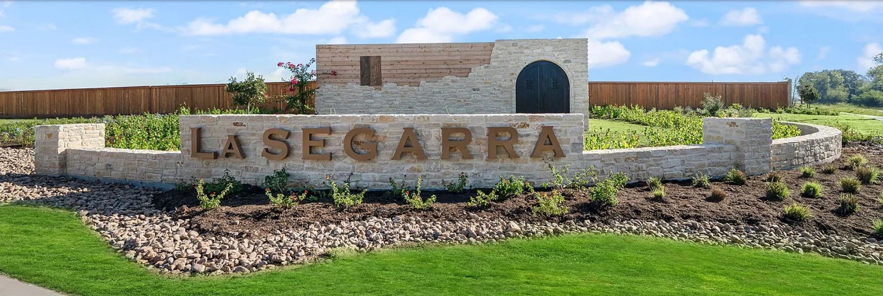 Entrance to the La Segarra community in Brookshire, TX, featuring signage and landscaping (Image 2).